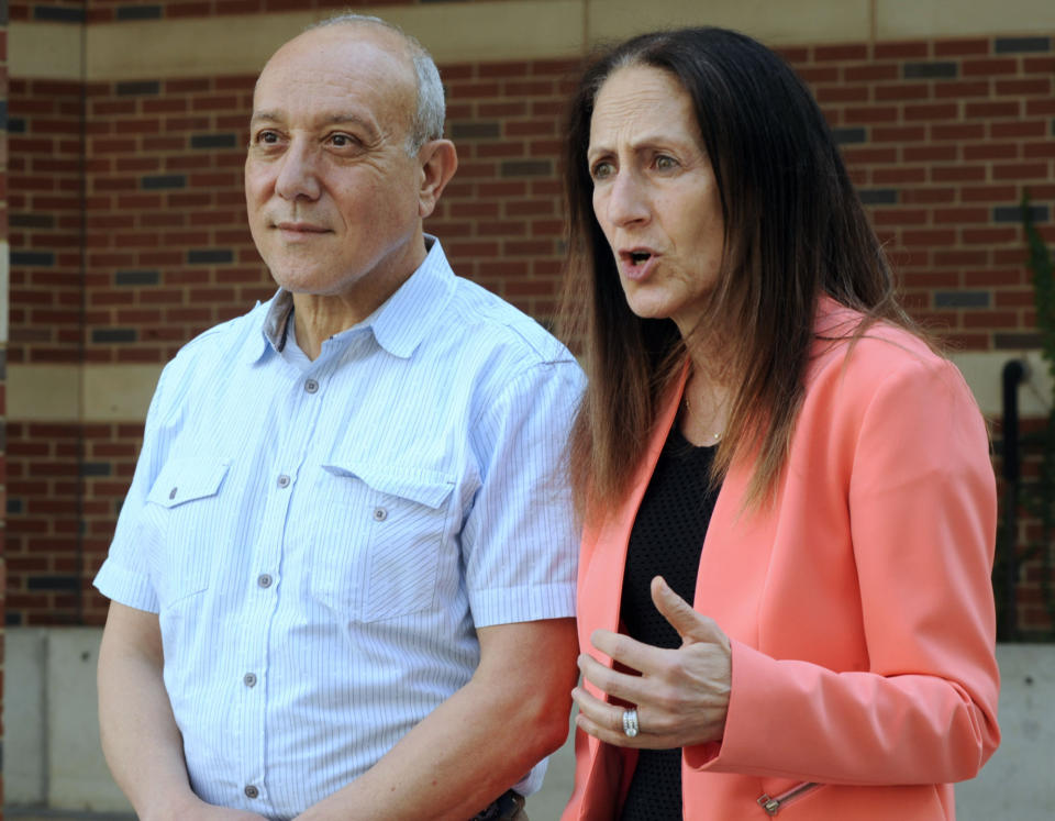 Dr. Hussein D. Abdul-Latif, left, and Dr. Morissa Ladinsky, two University of Alabama at Birmingham professors who treat patients with gender issues, speak during an interview in Birmingham, Ala., on Wednesday, April 13, 2022. (AP Photo/Jay Reeves)