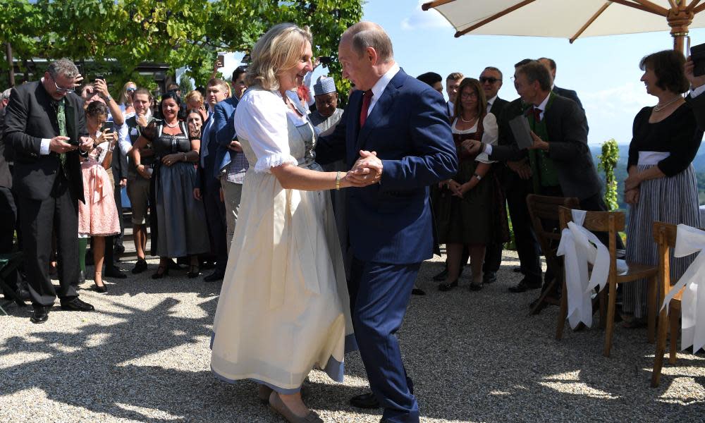 Austrian foreign minister Karin Kneissl and Russian president Vladimir Putin dance