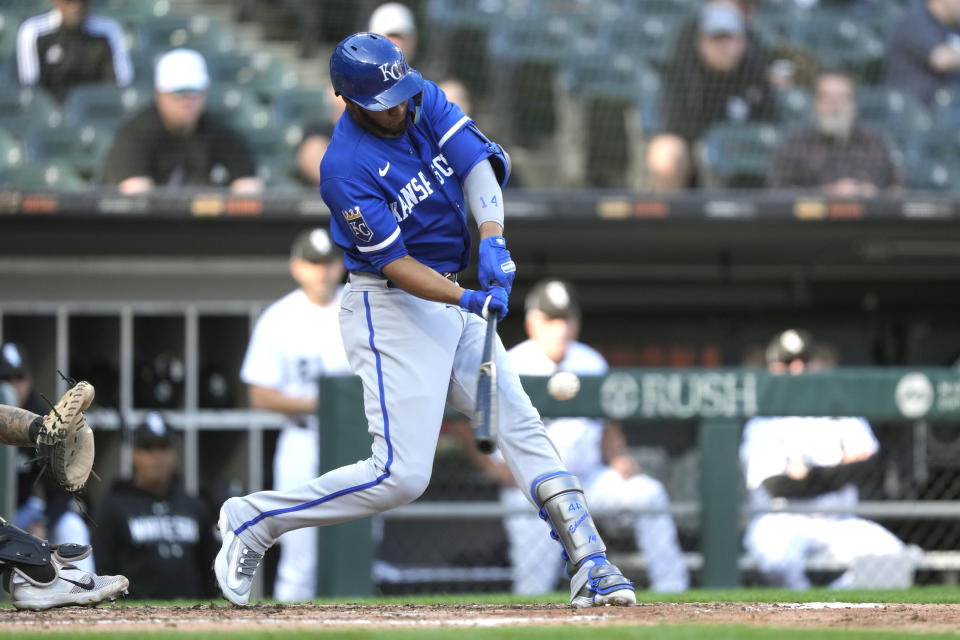 Kansas City Royals' Edward Olivares hits an RBI double off Chicago White Sox starting pitcher Dylan Cease during the fourth inning in the first baseball game of a doubleheader, Tuesday, Sept. 12, 2023, in Chicago. (AP Photo/Charles Rex Arbogast)