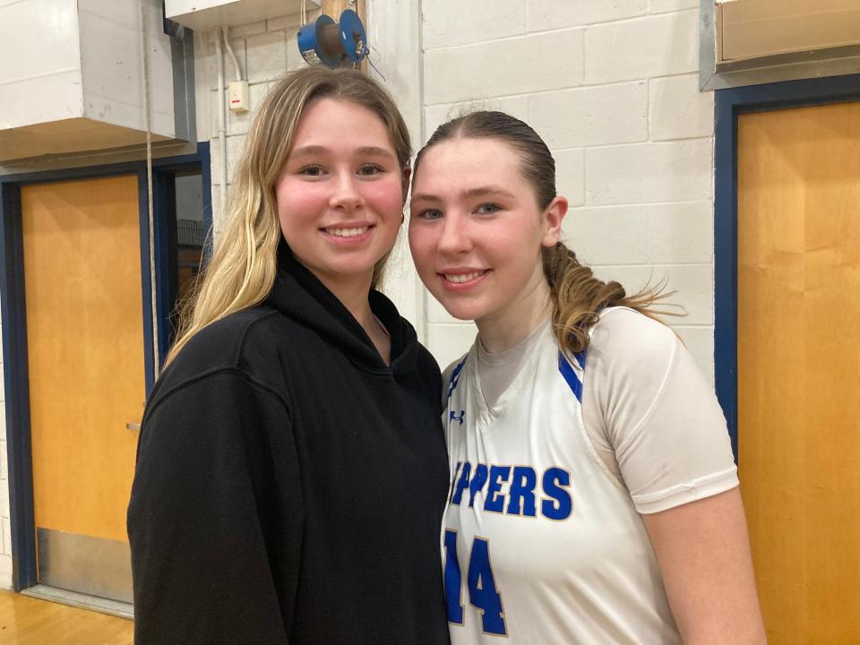 Grace Oliver, of Noble and Greenough School, (left) poses with her younger sister Maddie Oliver after watching Maddie's Norwell High team advance in the Div. 3 state tournament on Tuesday, March 5, 2024.