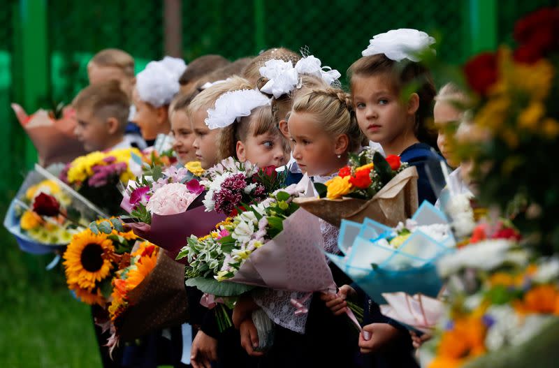 FILE PHOTO: First graders attend a ceremony marking the start of the new school year in Moscow