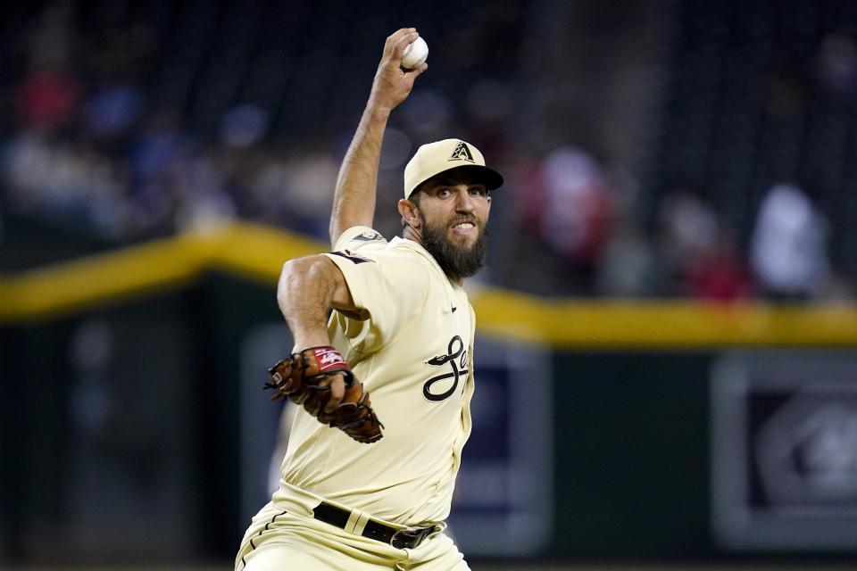 Arizona Diamondbacks starting pitcher Madison Bumgarner throws against the Colorado Rockies during the first inning of a baseball game Friday, Aug. 5, 2022, in Phoenix. (AP Photo/Ross D. Franklin)