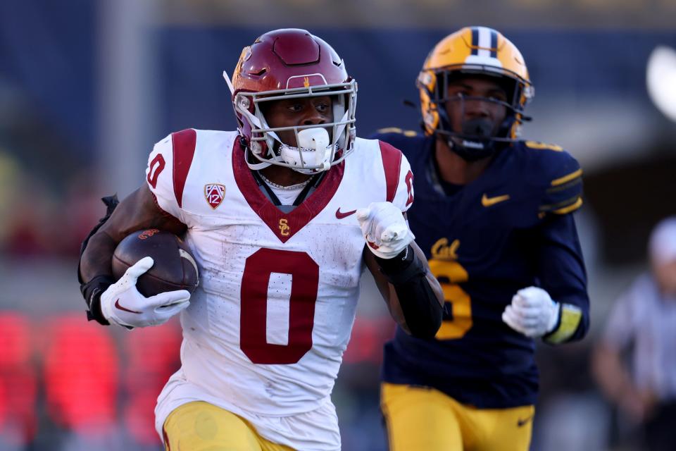 Southern California running back MarShawn Lloyd (0) runs against California defensive back Jeremiah Earby (6) during the second half of an NCAA college football game in Berkeley, Calif., Saturday, Oct. 28, 2023.