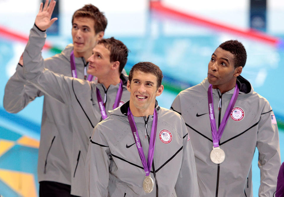 <p>Michael Phelps and teammates Adrian Nathan (L), Ryan Lochte (2nd L) and Cullen Jones ® celebrate with the silver medals won during the 4 x 100-meter freestyle relay final at the London 2012 Olympic Games on July 29, 2012. (Adam Pretty/Getty Images)</p>