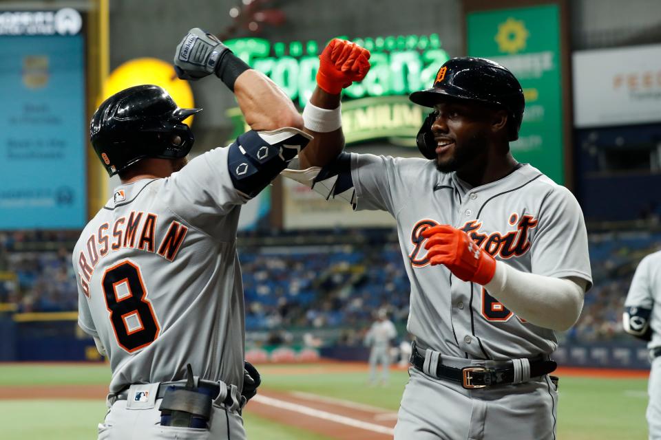 Detroit Tigers' Akil Baddoo, right, celebrates his home run with teammate Robbie Grossman during the first inning of a baseball game against the Tampa Bay Rays, Friday, Sept. 17, 2021, in St. Petersburg, Fla.