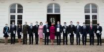 TOPSHOT - Newly appointed Slovak Prime Minister Igor Matovic (C-L), leader of the OLaNO anti-graft party and President Zuzana Caputova (C-R) pose for a family picture with Ministers after a swearing in ceremony of the new four-party coalition government on March 21, 2020 outside of the Presidential palace in Bratislava. - The ceremony was held without members of the press and all appointed government members wore gloves and face mask to prevent the spread of novel coronavirus. (Photo by JOE KLAMAR / AFP) (Photo by JOE KLAMAR/AFP via Getty Images)