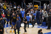 Officials work on mopping up a rain leak from the American Airlines Center roof during the second half of Game 4 of the NBA basketball playoffs Western Conference finals between the Dallas Mavericks and the Golden State Warriors, Tuesday, May 24, 2022, in Dallas. (AP Photo/Tony Gutierrez)