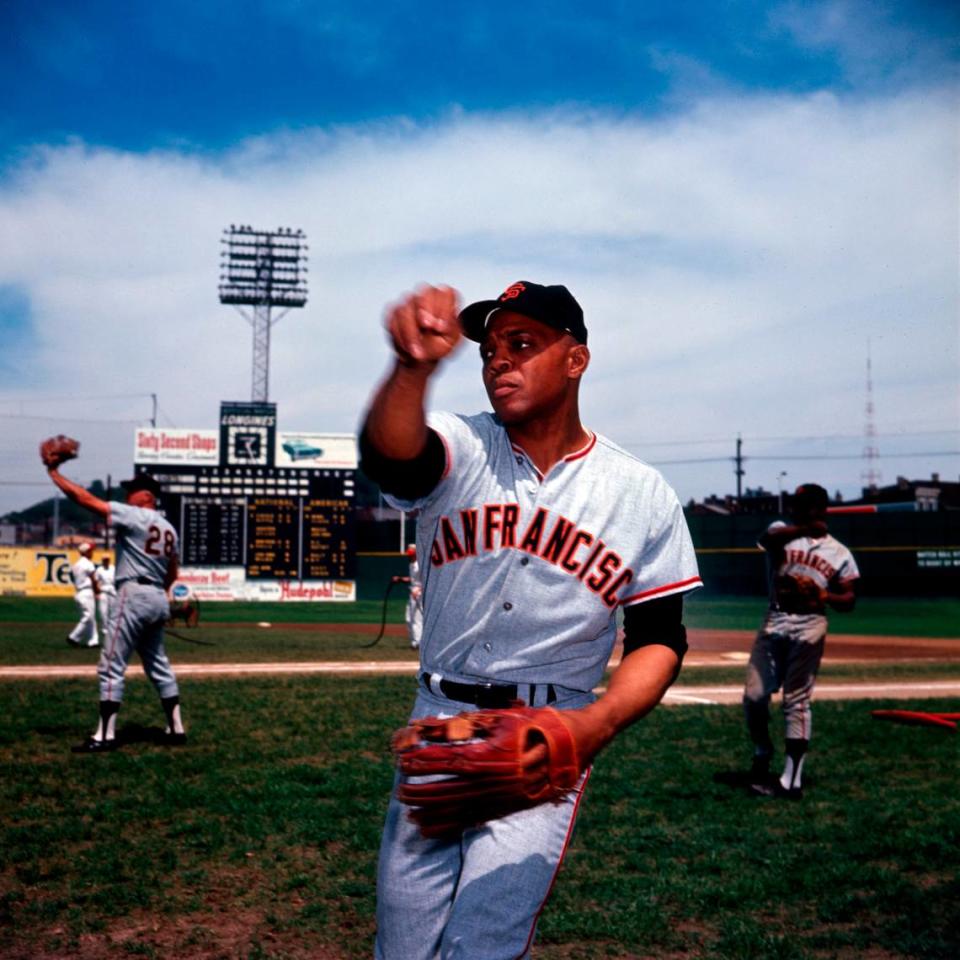 San Francisco Giants center fielder Willie Mays plays catch on the field before a game.