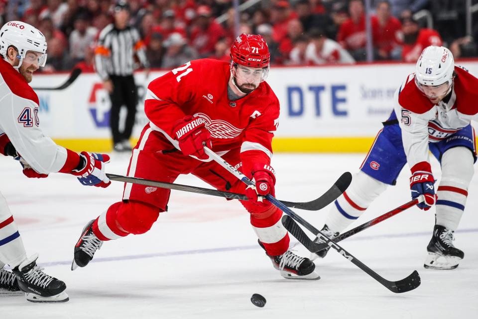 Detroit Red Wings center Dylan Larkin (71) skates against Montreal Canadiens right wing Joel Armia (40) and center Alex Newhook (15) during the third period at Little Caesars Arena in Detroit on Monday, April 15, 2024.
