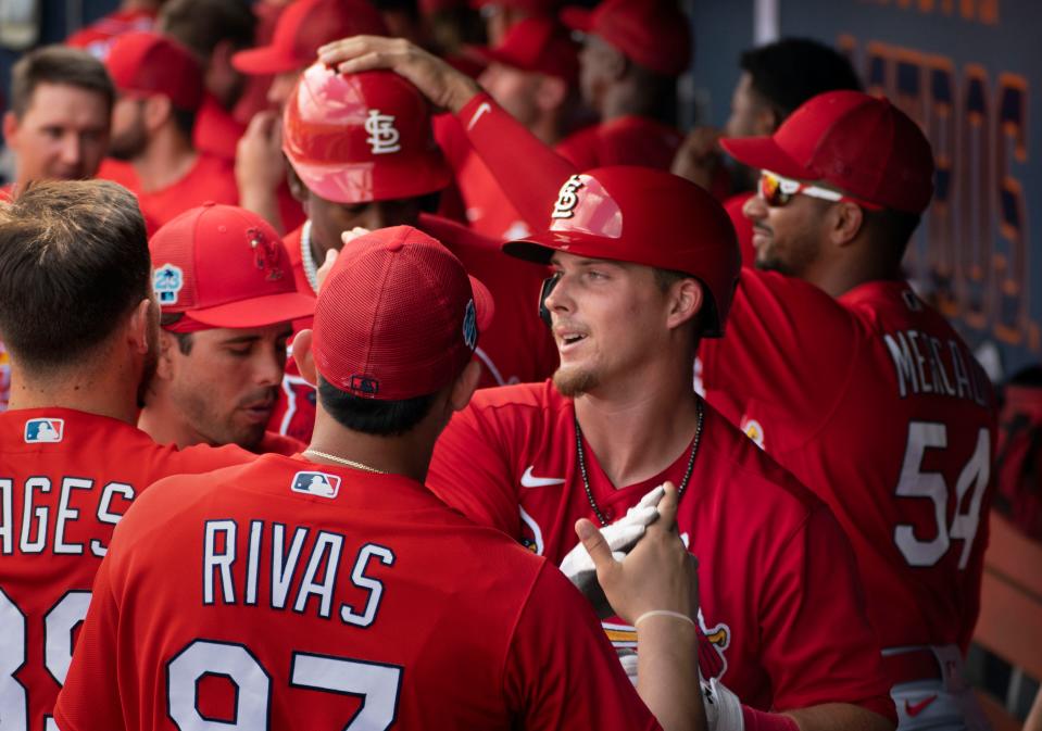 St.  Louis Cardinals Nolan Gorman is congratulated by teammates after hitting a two-run homer against the Washington Nationals spring training game at the Ballpark of the Palm Beaches in West Palm Beach, Florida on March 4, 2023. 