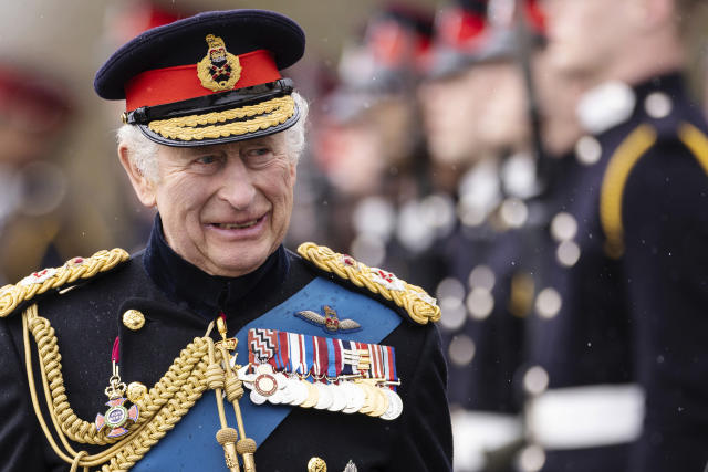 FILE - Britain&#39;s King Charles III inspects the 200th Royal Military Academy Sandhurst Sovereign&#39;s Parade and presents the new Colours and Sovereign&#39;s Banner to the receiving Ensigns in Camberley, England, Friday, April 14, 2023. King Charles III will be crowned Saturday, May 6, 2023 at Westminster Abbey in an event full of all the pageantry Britain can muster. (Dan Kitwood/Pool Photo via AP, File)