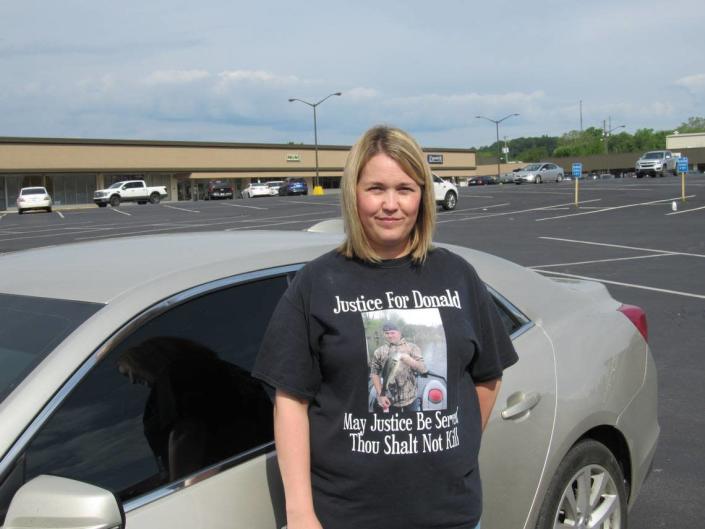 Melinda Mills, of Knox County, is the sister of Donald Mills, who was killed during a robbery in 2014. Mills wears a T-shirt calling for justice for her brother.
