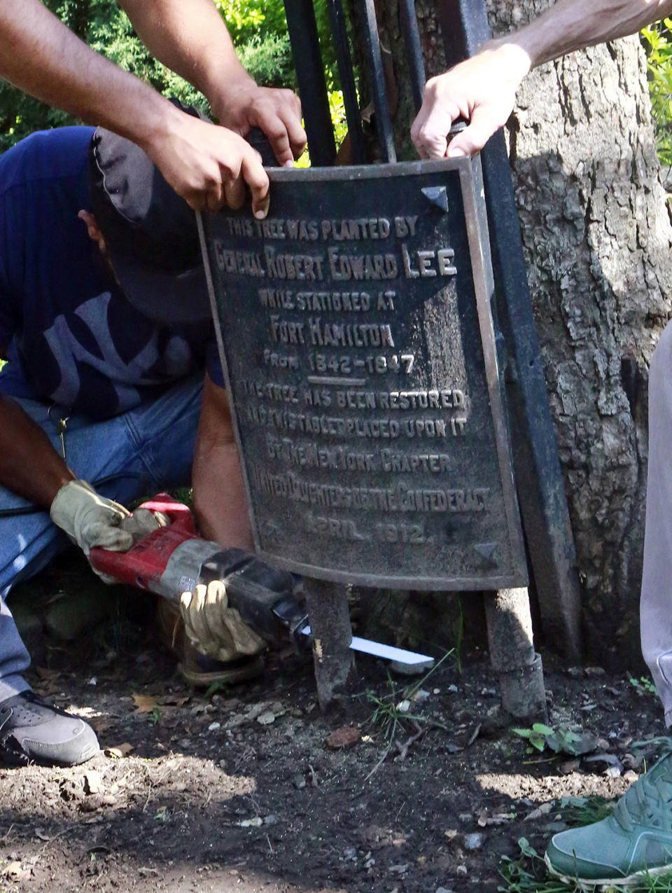 <p>A plaque, one of two honoring Confederate Gen. Robert E. Lee, lies on the ground after workers removed it from the property of St. John’s Episcopal Church, Aug. 16, 2017, in the Bay Ridge section of Brooklyn, New York. The removal comes in the wake of last weekend’s deadly white nationalist rally in Charlottesville, Virginia, where white supremacists protested plans to remove a Lee statue from a public park. (AP Photo/Bebeto Matthews) </p>