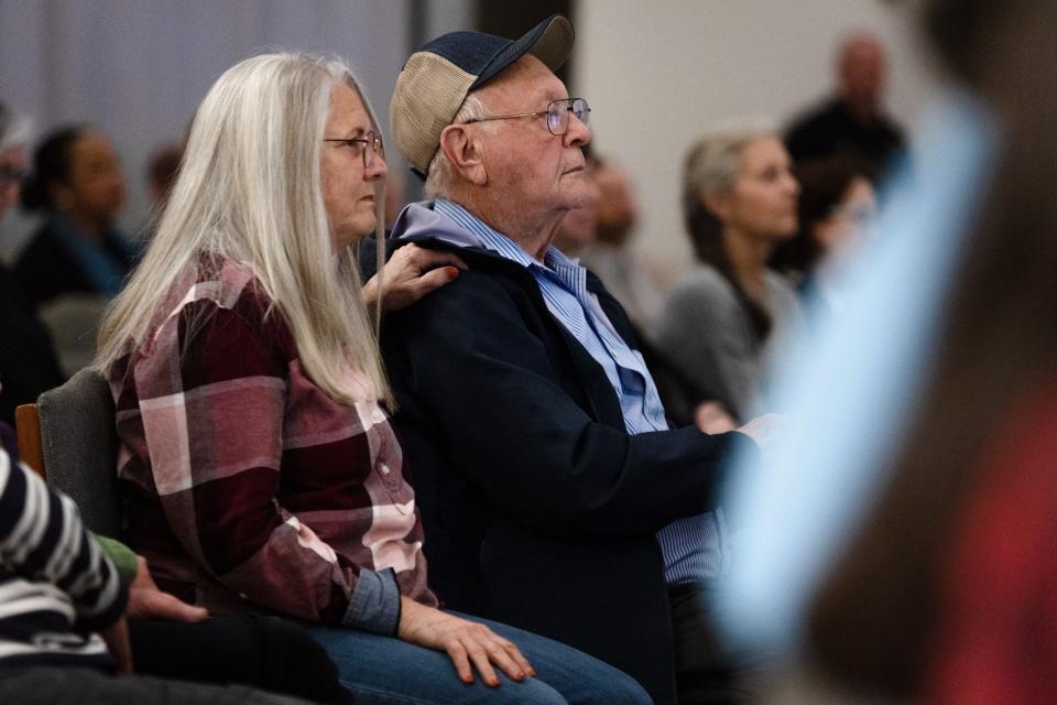 Community members listen to Rabbi Kelly Levy close Wednesday's commemoration of the 2021 arson attack on the Congregation Beth Israel synagogue.