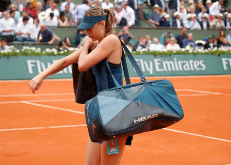 Tennis - French Open - Roland Garros, Paris, France - June 6, 2018 Russia's Maria Sharapova walks off court after losing her quarter final match against Spain's Garbine Muguruza REUTERS/Charles Platiau