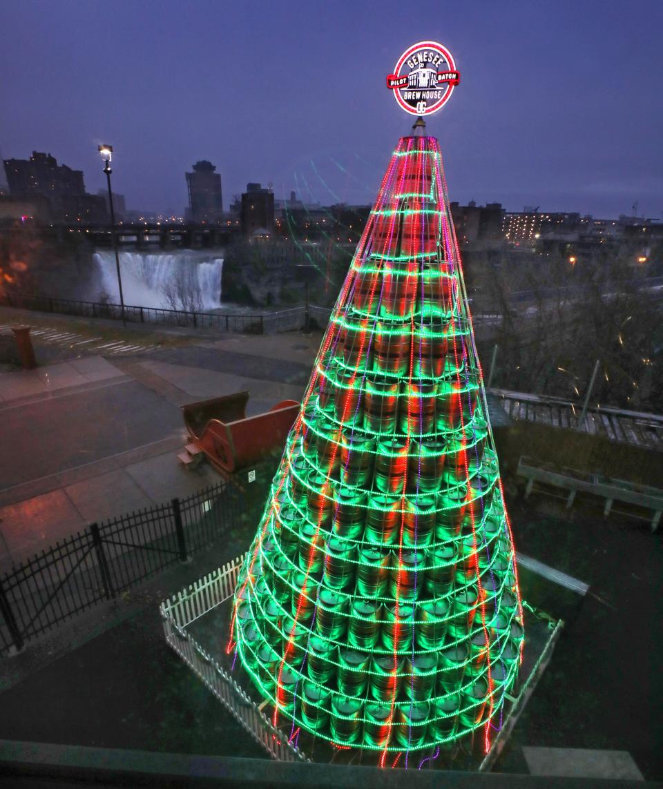 From December 2021: The 27-foot-high Genesee Brewery Keg Tree gives off a festive holiday glow outside the Genesee Brew House.