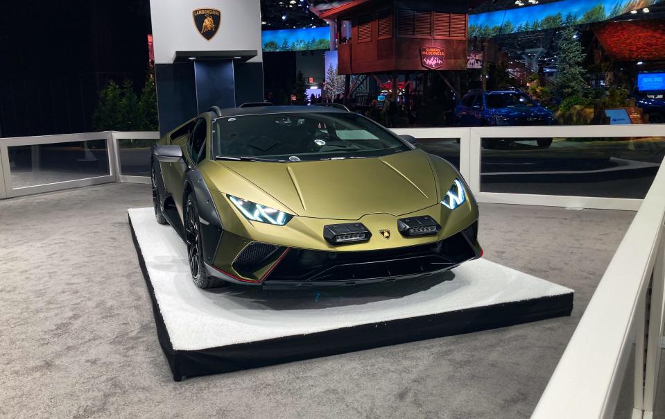 A shiny, green Lamborghini Huracan Sterrato.