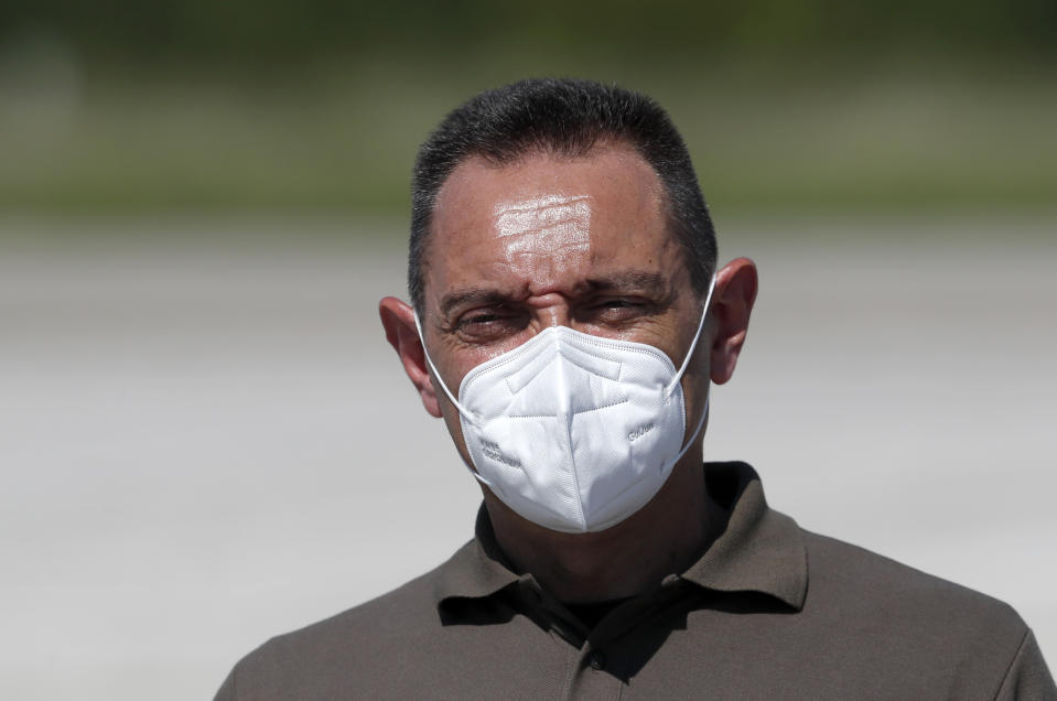 In this photo taken Friday, Aug. 21, 2020, Serbia Defense Minister Aleksandar Vulin wearing a mask to protect against coronavirus speaks after the military exercises on Batajnica, military airport near Belgrade, Serbia. Vulin said Wednesday Sept. 9, 2020, the government decided to suspend all war games "after tremendous and undeserved pressure" from the European Union. (AP Photo/Darko Vojinovic)