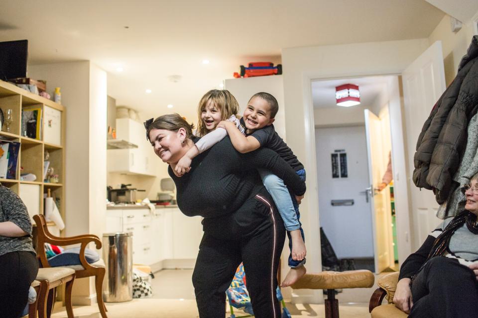 <p>Amy Chapman plays with Adbul, 4, and Noor, 6, at the Arnout family home in Devon</p>Andrew McConnel