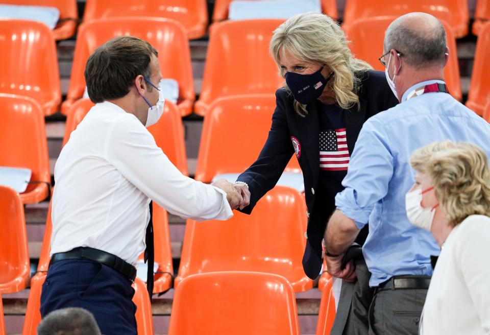 French President Emmanuel Macron greets First Lady Jill Biden before a 3x3 basketball game between France and the USA during the Tokyo 2020 Olympic Summer Games at Aomi Urban Sports Park on July 24.