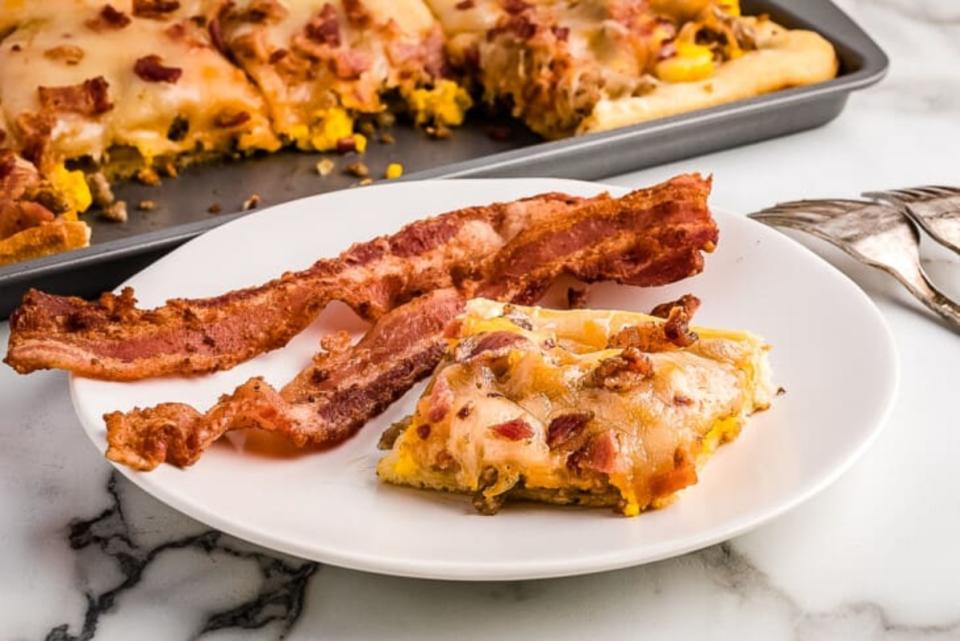 <p>Julie's Eats and Treats</p><p>Quick and easy 2 meat breakfast pizza is the perfect lazy morning breakfast or delicious on a school morning or even perfect for dinner to mix pizza night up!</p><p><strong>Get the recipe: <a href="https://www.julieseatsandtreats.com/breakfast-pizza/" rel="nofollow noopener" target="_blank" data-ylk="slk:2 Meat Breakfast Pizza;elm:context_link;itc:0;sec:content-canvas" class="link ">2 Meat Breakfast Pizza</a></strong></p>