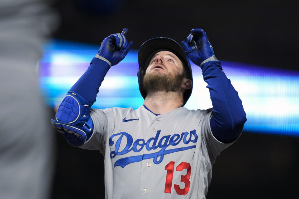 Los Angeles Dodgers' Max Muncy celebrates after hitting a solo home run against the San Francisco Giants during the fifth inning of a baseball game in San Francisco, Wednesday, April 12, 2023. (AP Photo/Godofredo A. Vásquez)