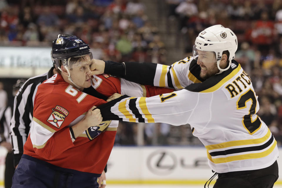 Florida Panthers defenseman Riley Stillman (61) and Boston Bruins left wing Nick Ritchie (21) fight during the first period of an NHL hockey game, Thursday, March 5, 2020, in Sunrise, Fla. (AP Photo/Wilfredo Lee)
