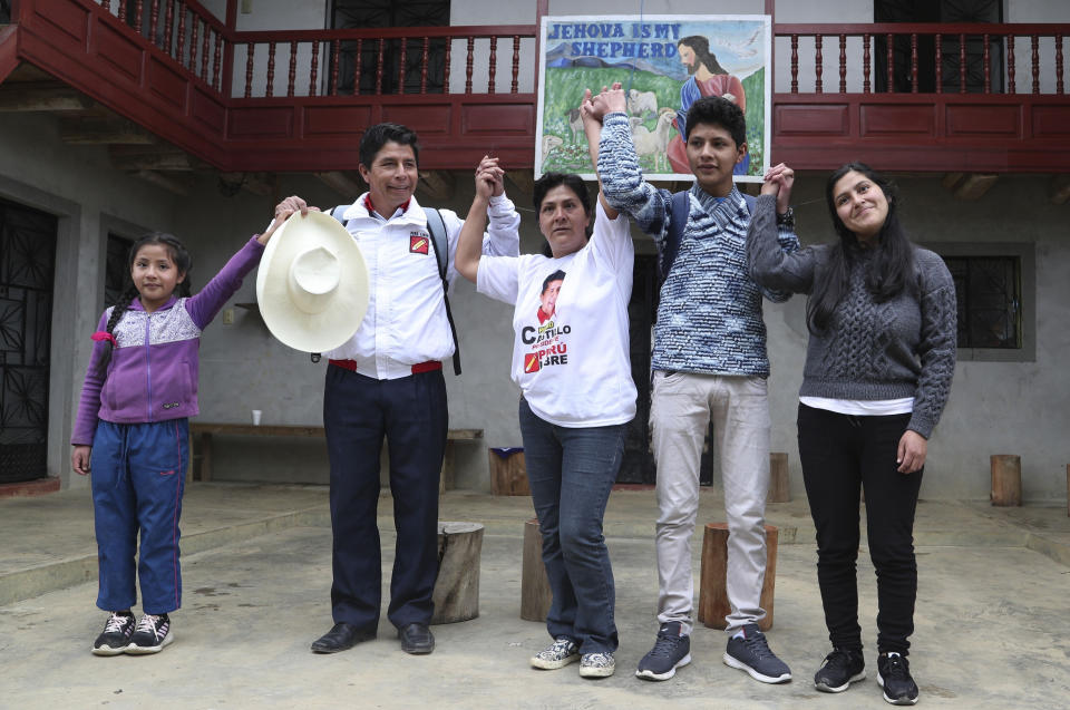 FILE - Then presidential candidate Pedro Castillo poses for a photo with his family; daughter Alondra 9, from left, son Arnold 16, wife Lilia Paredes, and sister-in-law Yenifer Paredes, in Chugur, Peru, Friday, April 16, 2021. Castillo's sister-in-law whom he raised and considers a daughter, was ordered by a judge on Sunday, Aug. 28, 2022, to be held in prison up to 2.5 years while she is investigated for criminal association and corruption for her participation in an alleged money laundering scheme involving the president and first lady. (AP Photo/Martin Mejia, File)