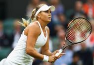 <p>Kateryna Kozlova of Ukraine looks on forehand during the Ladies Singles second round match against Agnieszka Radawanska of Poland on day three of the Wimbledon Lawn Tennis Championships at the All England Lawn Tennis and Croquet Club on June 29, 2016 in London, England. (Photo by Julian Finney/Getty Images)</p>