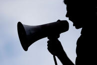 <p>A supporter of Sen. Bernie Sanders yells at delegates through a bullhorn at Franklin Delano Roosevelt Park in Philadelphia, Tuesday, July 26, 2016, during the second day of the Democratic National Convention. (Photo: Matt Slocum/AP)</p>