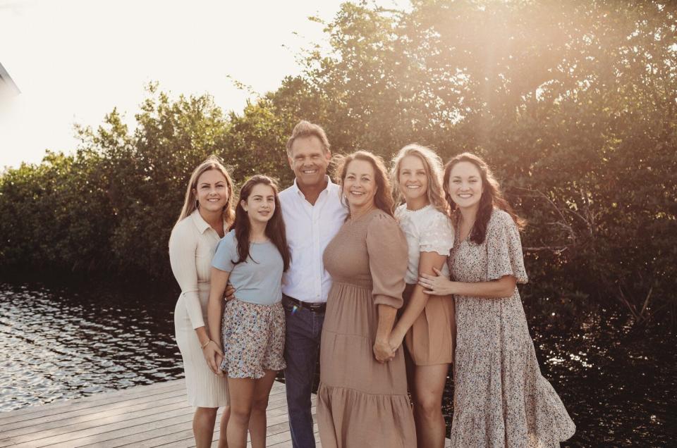 Former Naples High School football coach Bill Kramer, with his wife Susan, and their four daughters.