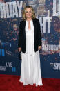 Wearing winter white and covering up with a black blazer, Amy Poehler pulls off the classic color combination.