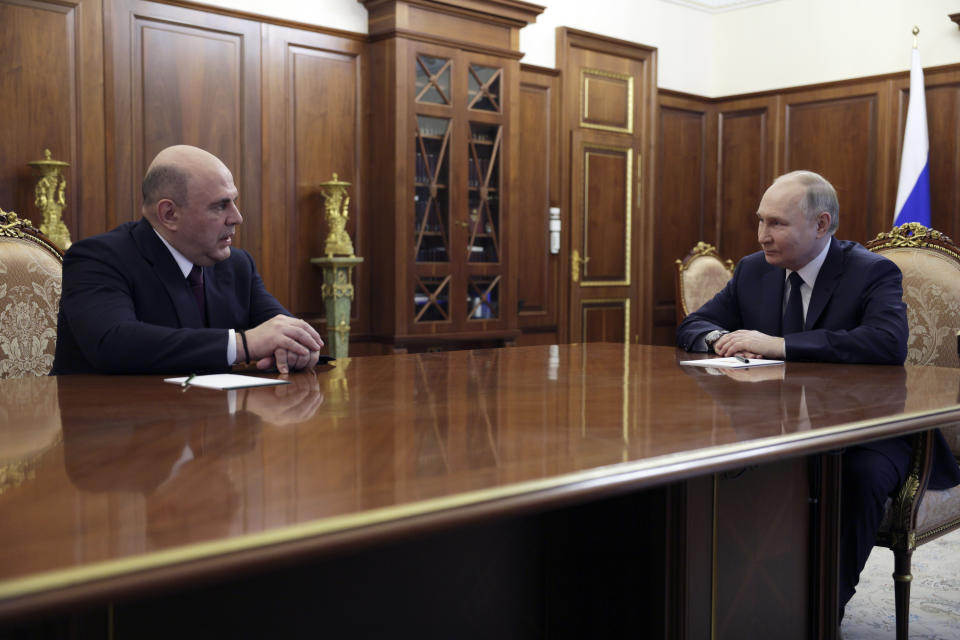 Russian President Vladimir Putin, right, listens to Mikhail Mishustin, the candidate for the post of Russian Prime Minister during their meeting at the Kremlin in Moscow, Russia, Friday, May 10, 2024. (Gavriil Grigorov, Sputnik, Kremlin Pool Photo via AP)