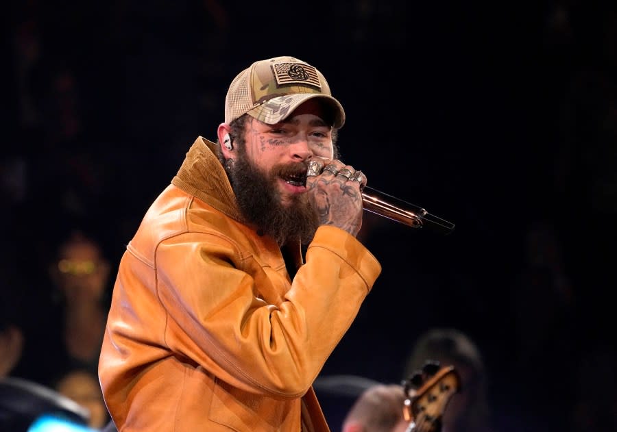 FILE – Post Malone performs a medley at the 57th Annual CMA Awards on Wednesday, Nov. 8, 2023, in Nashville, Tenn. Post Malone will perform “America the Beautiful” at the Super Bowl. (AP Photo/George Walker IV, File)