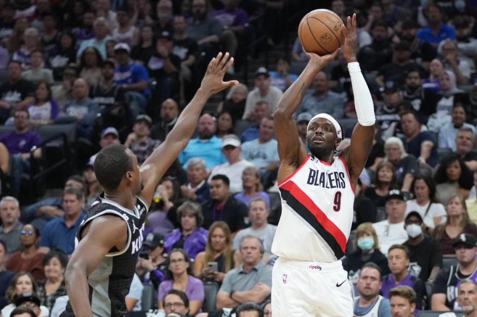 Portland Trail Blazers forward Jerami Grant (9) shoots the basketball against Sacramento Kings forward Harrison Barnes (40) during the first quarter at Golden 1 Center on Oct. 19, 2022.