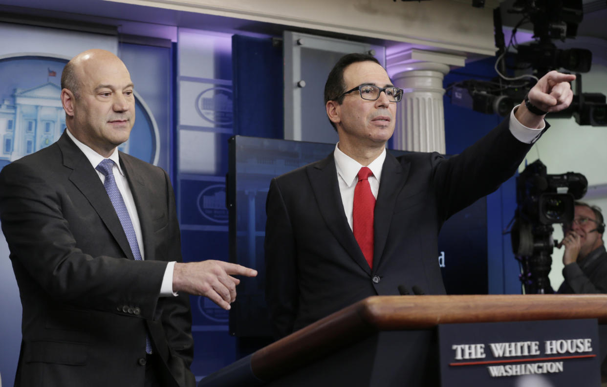 U.S. National Economic Director Gary Cohn (L) and Treasury Secretary Steven Mnuchin unveil the Trump administration's tax reform proposal in the White House briefing room in Washington, U.S, April 26, 2017. REUTERS/Kevin Lamarque