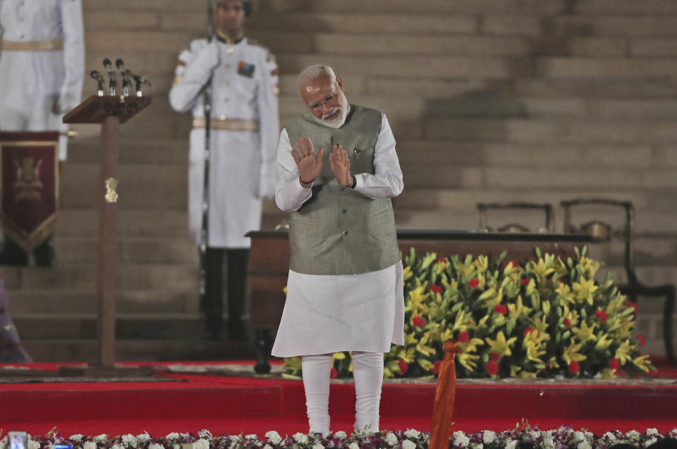 Indian Prime Minister Narendra Modi, center, talks to the invitees at the end of the swearing in ceremony at the forecourt of presidential palace in New Delhi, India, Thursday, May 30, 2019. Modi was sworn in Thursday for a second term after an overwhelming election victory for his Hindu nationalist party in a country of 1.3 billion people seeking swift economic change. (AP Photo/Manish Swarup)