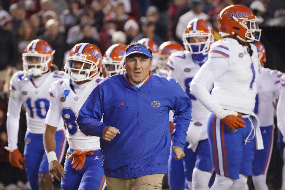 Florida head coach Dan Mullen leads his team onto the field before an NCAA college football game against South Carolina Saturday, Nov. 6, 2021, in Columbia, S.C. South Carolina won 40-17. (AP Photo/Sean Rayford)