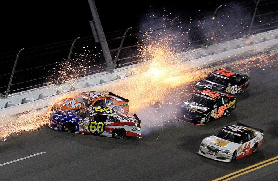 daytona beach, fl july 05 jason white , driver of the 24 jw demolition toyota, crashes into travis pastrana, driver of the 60 roush fenway racing racetrac ford, during the nascar nationwide series subway firecracker 250 at daytona international speedway on july 5, 2013 in daytona beach, florida photo by sean gardnergetty images