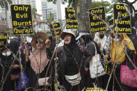 Muslim protesters shout slogans during a rally outside the Swedish Embassy in Jakarta, Indonesia, Monday, Jan. 30, 2023. Hundreds of Indonesian Muslims marched to the heavily guarded Swedish Embassy in the country's capital on Monday to denounce the recent desecration of Islam's holy book by far-right activists in Sweden and the Netherlands. (AP Photo/Tatan Syuflana)