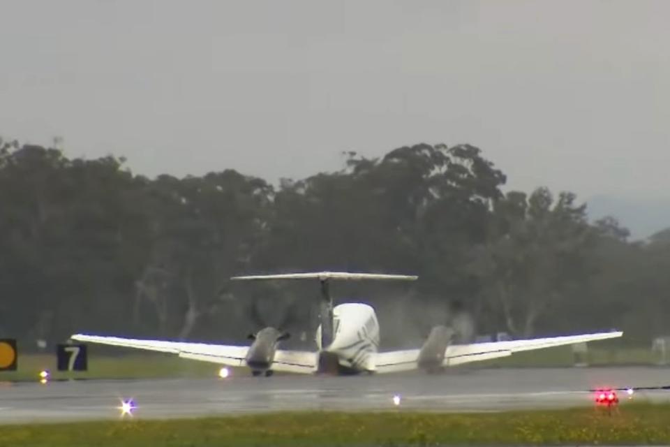 <p>Sky News Australia/Youtube</p> A plane with failed landing gear landing at Newcastle Airport in Australia 