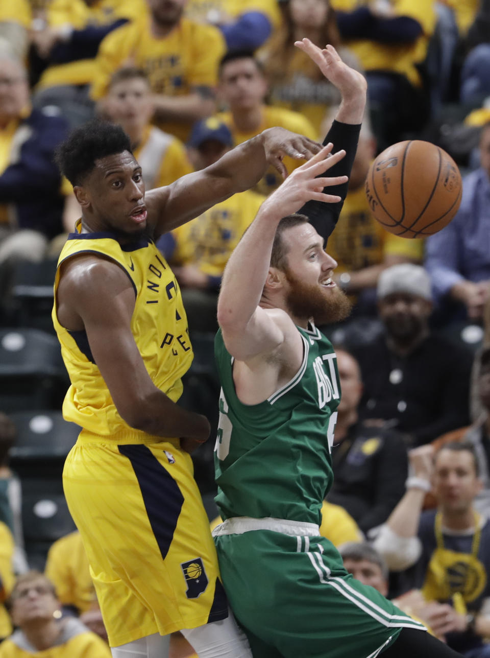 Indiana Pacers forward Thaddeus Young (21) comes from behind to block the shot of Boston Celtics center Aron Baynes (46) during the second half of Game 3 of an NBA basketball first-round playoff series, Friday, April 19, 2019, in Indianapolis. (AP Photo/Darron Cummings)