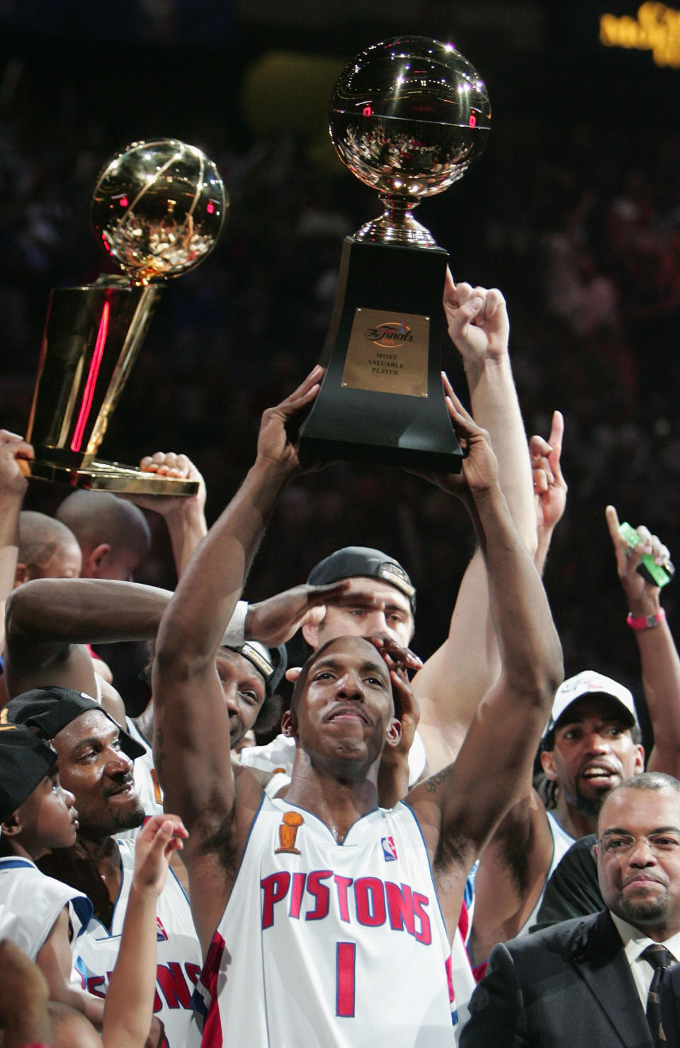 Chauncey Billups #1 of the Detroit Pistons holds up the most valuable player trophy after defeating the Los Angeles Lakers in game five of the 2004 NBA Finals on June 15, 2004 at The Palace of Auburn Hills in Auburn Hills, Michigan. The Pistons won 100-87. Billups was named MVP of the FInals.