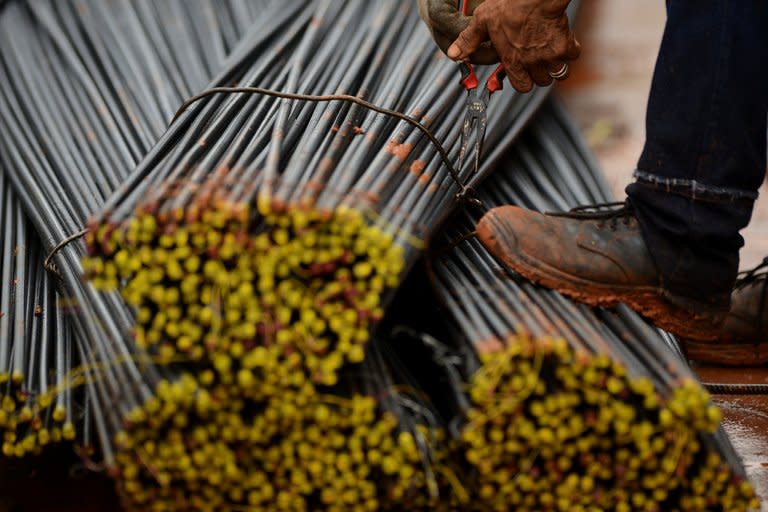 A worker handles steel bars at a construction site in Manila on May 30, 2013. The Philippines posted surprisingly strong growth of 7.8 percent in the first quarter of the year, official data shows, cementing its status as one of Asia's most dynamic economies