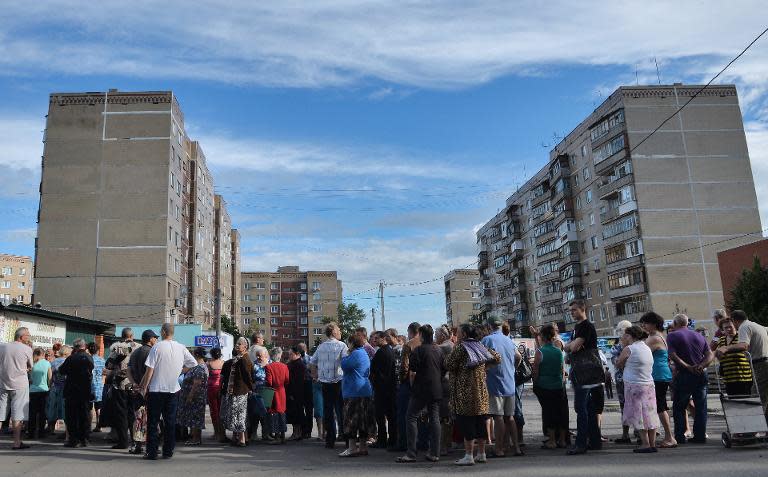 Slavyansk residents queue for water after an explosion destroyed the main water supply to the eastern city on June 11, 2014