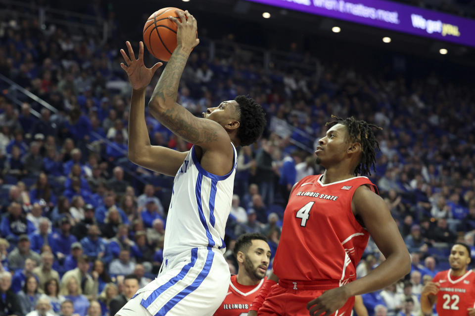 Kentucky's Justin Edwards, left, shoots near Illinois State's Myles Foster (4) during the first half of an NCAA college basketball game in Lexington, Ky., Friday, Dec. 29, 2023. (AP Photo/James Crisp)