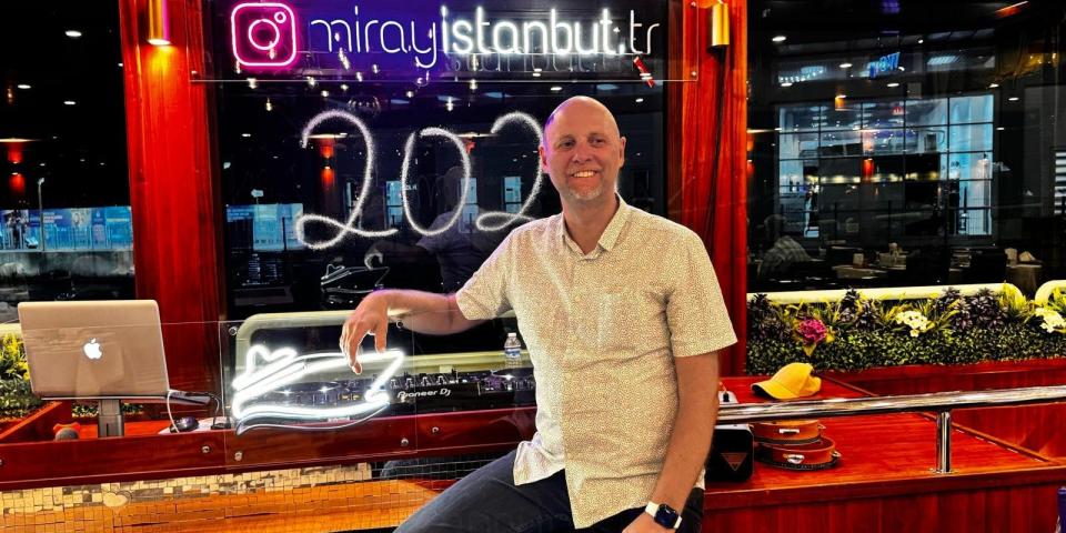 Adam in front of a Miray sign in Istanbul.