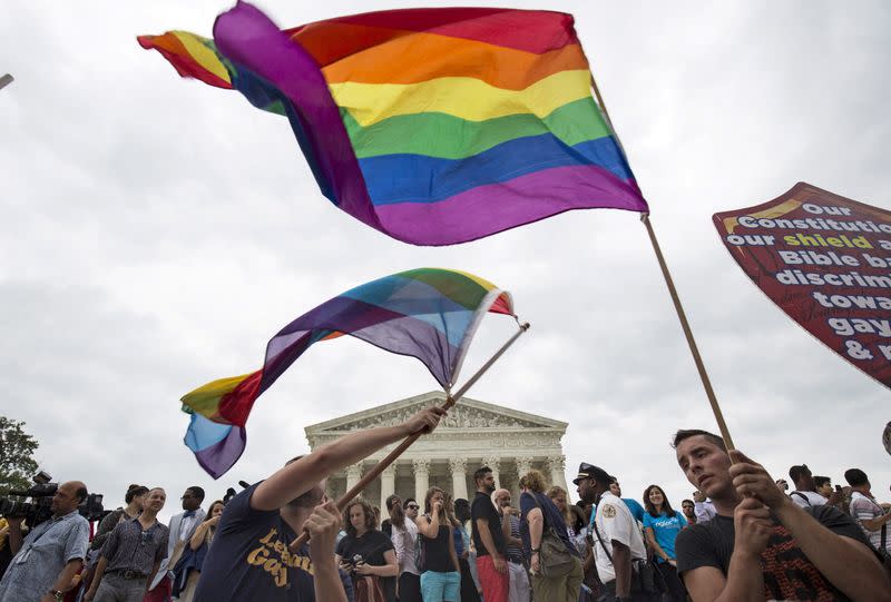 Supporters of gay marriage wave the rainbow flag after the U.S. Supreme Court ruled that the U.S. Constitution provides same-sex couples the right to marry. (Reuters)