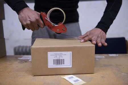 A box is packaged for delivery at Fragrances of Ireland perfume warehouse in Wicklow, Ireland May 3 2016. REUTERS/Clodagh Kilcoyne