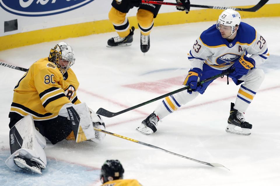 Buffalo Sabres' Sam Reinhart (23) scores on Boston Bruins' Dan Vladar (80) during the first period of an NHL hockey game, Saturday, March 27, 2021, in Boston. (AP Photo/Michael Dwyer)